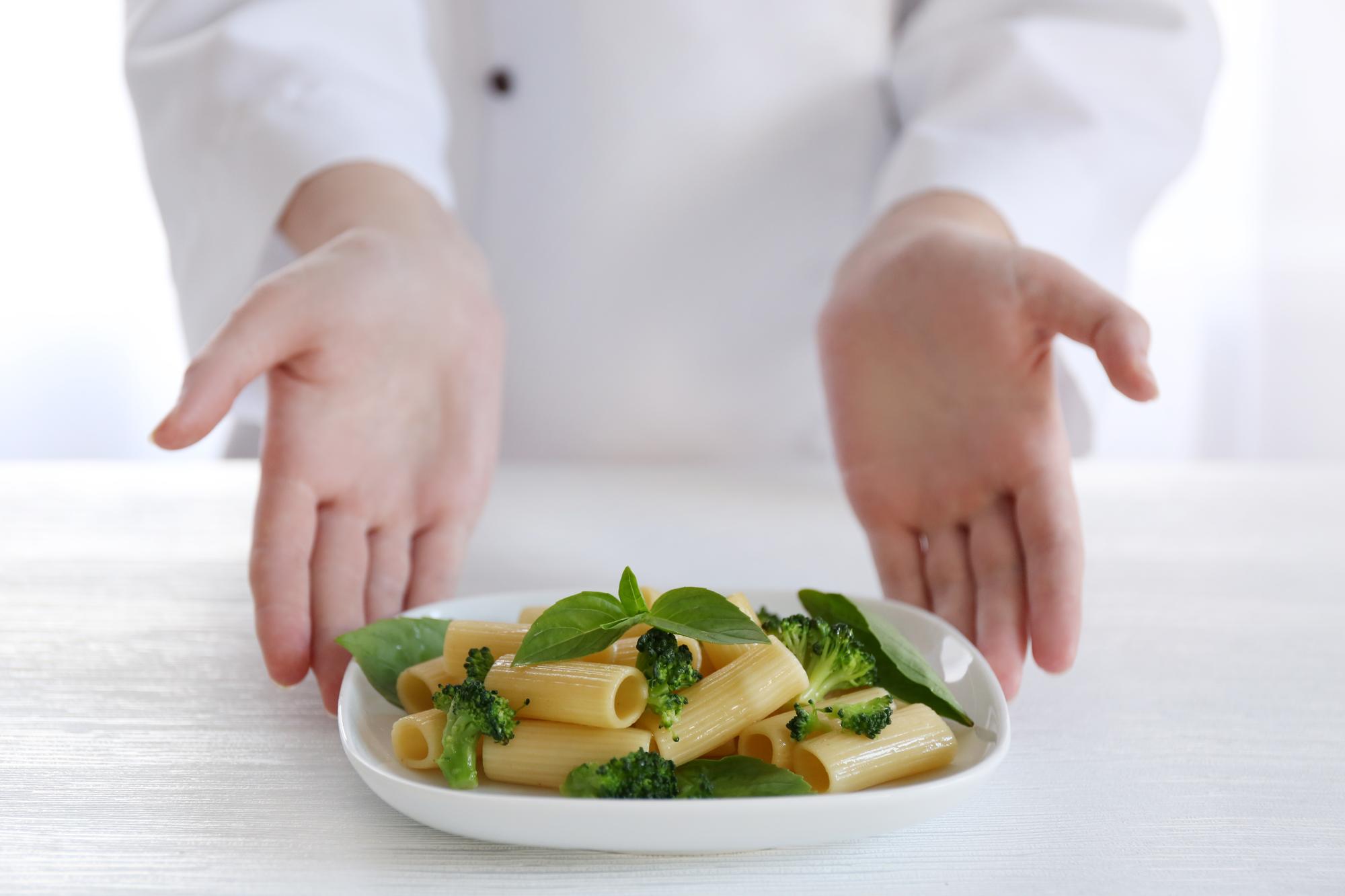 Chef arranging a plated dish